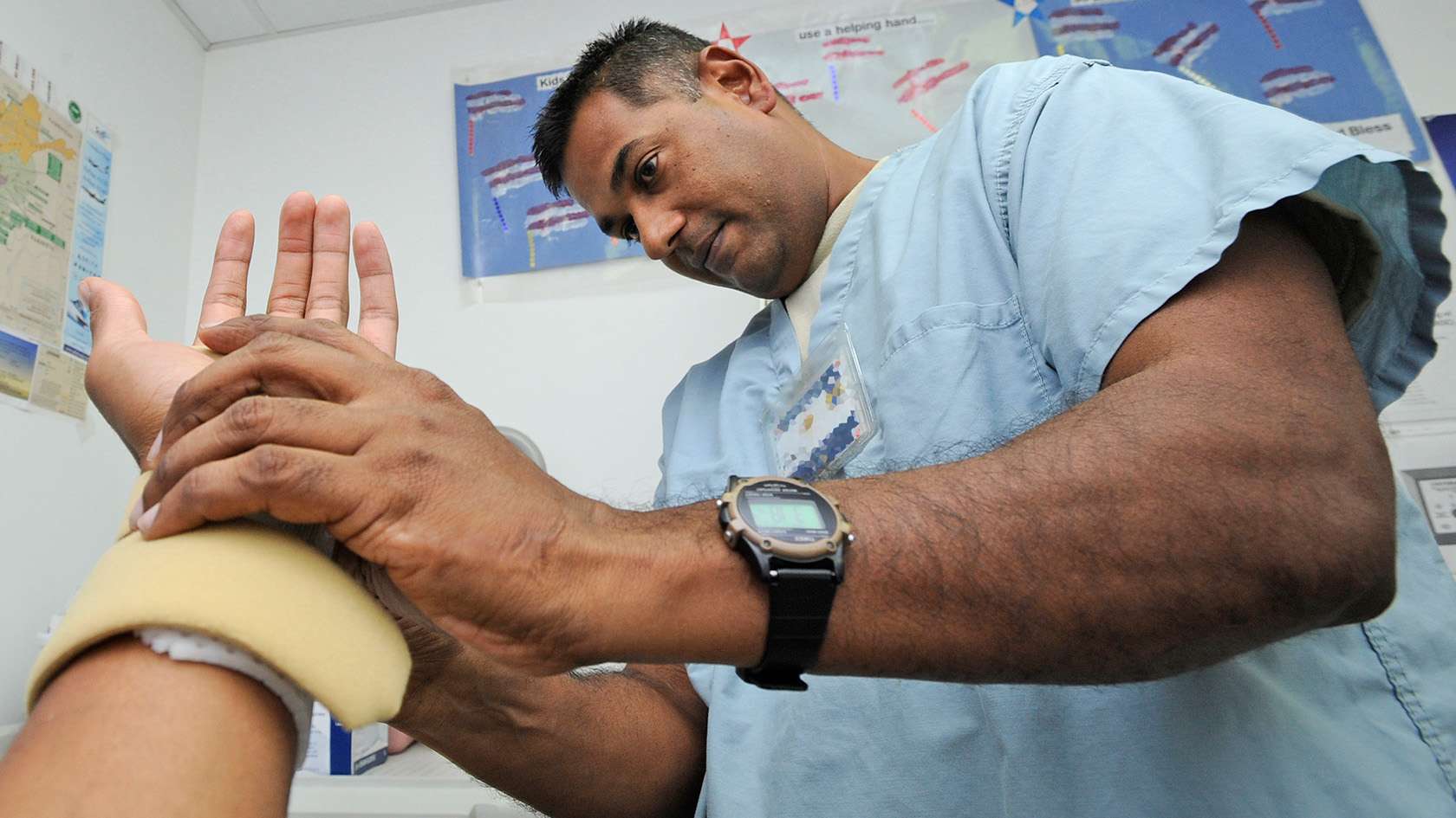 occupational therapist inspecting a splint 